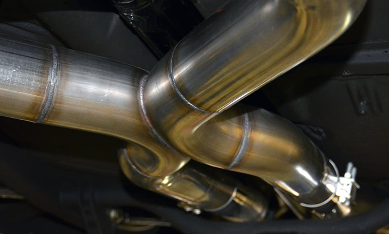 I know, I know: I’m a car guy, which means I’m not normal in more ways than one. But this is the prettiest thing I’ve seen in a long time. A three-inch “X” pipe system in stainless steel. The artist is Troy of Advanced Chassis.