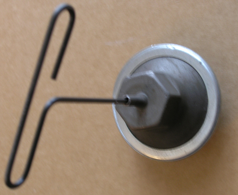 The Allen wrench in this Ford vacuum advance can is used to adjust how much spark timing advance the engine will get from this mechanism. The Allen wrench in this Ford vacuum advance can is used to adjust how much spark timing advance the engine will get from this mechanism.