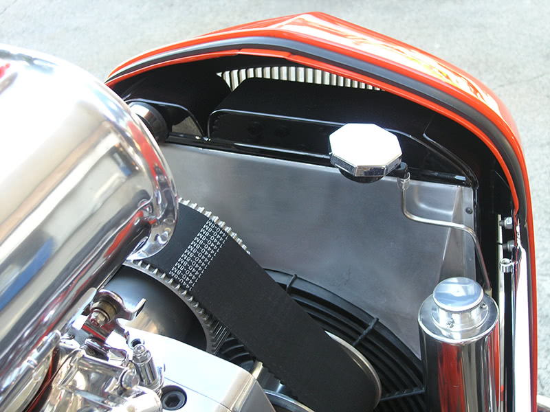 The air gap above the radiator of this supercharged street rod is allowing cool air to flow around the radiator instead of through it.