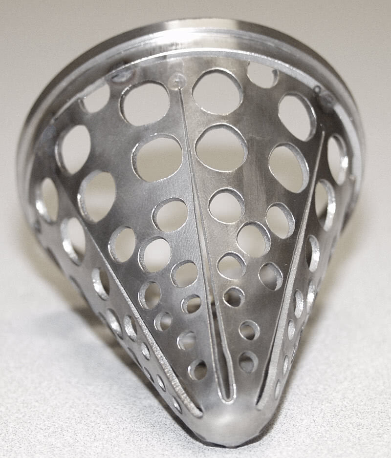 This seemingly simple cone-shaped device is deceptive in its appearance. You’d think this sound-dampening component would necessary restrict the free flow of exhaust gases. But its ingenious design incorporates a collection of holes whose total area exceeds the area of an unmodified pipe, resulting in a tuning of the exhaust tone with no increase in back pressure.