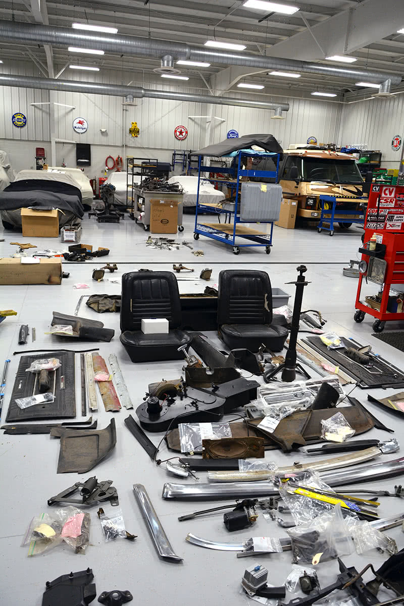 Left: As parts were decanted, sorted, and identified, we carefully laid out the bones on the floor to see if we could tell what we had and what we didn’t have so we could start finding missing pieces. No matter how good your plan, you’ll miss things. A parts manual and assembly manual are excellent resources to have at hand if you get a basket case in for reassembly. This is just part of the reason why a basket case costs a lot more money than a car that arrives assembled. We’ve been through this at least three times now and in every case it adds a ton to the workload and to the cost of the finished project. Rear axle parts and layout