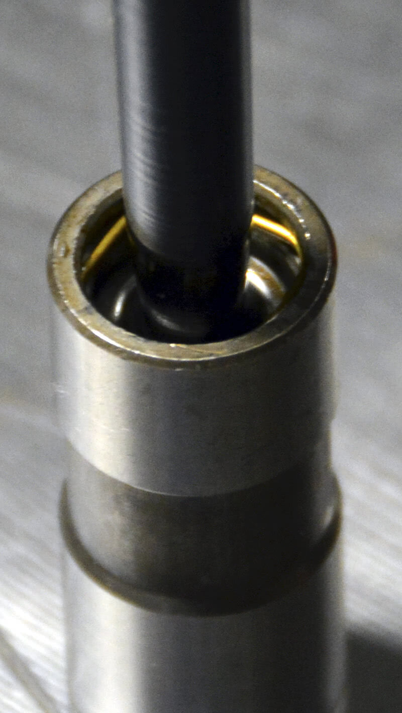 This off-the-shelf hydraulic lifter has .140 in. of total travel. Stock adjustment procedures suggest that the plunger be depressed roughly half the total travel, or about .070 in. in this case. I don’t normally set them this deep. I normally only put them about .025 in. down in the bore and I measure it with a wire gauge between the plunger and the retaining clip. This off-the-shelf hydraulic lifter has .140 in. of total travel. Stock adjustment procedures suggest that the plunger be depressed roughly half the total travel, or about .070 in. in this case. I don’t normally set them this deep. I normally only put them about .025 in. down in the bore and I measure it with a wire gauge between the plunger and the retaining clip.