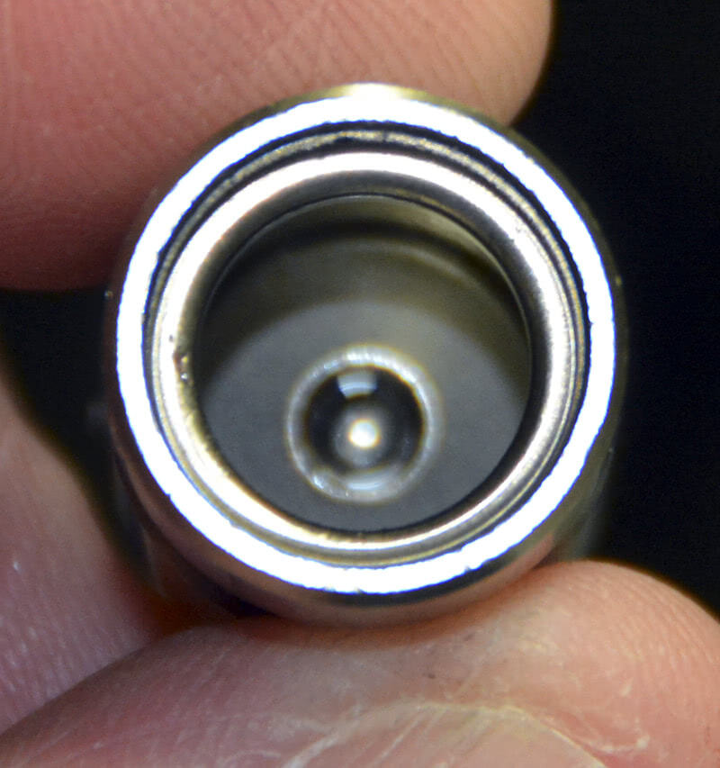 On the bottom of the internal plunger is the check ball that unseats with oil pressure when the lifter is on the base circle so oil can flow through the lifter body. The check ball is spring-loaded against the bottom of the plunger and when the outer body accelerates up it seals the oil inside the main body thus transmitting lobe lift to the rocker arm.